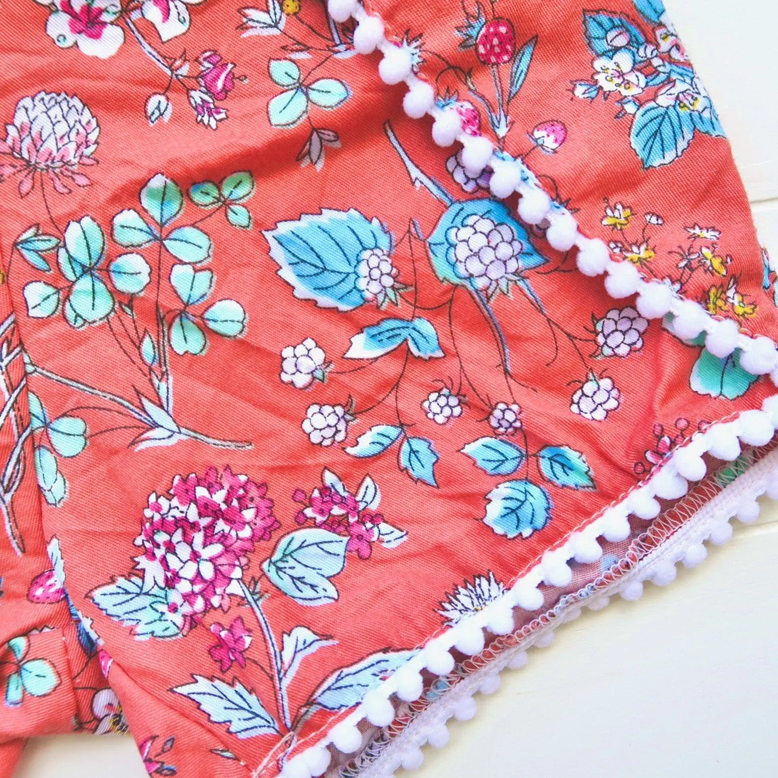 Pompom Shorts in Red Orange Garden Print